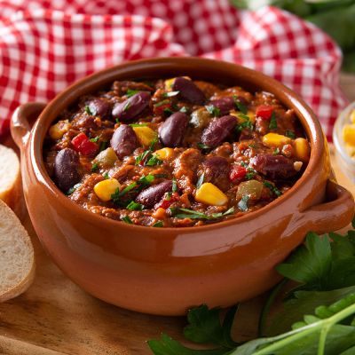 traditional-mexican-tex-mex-chili-con-carne-bowl-black-background